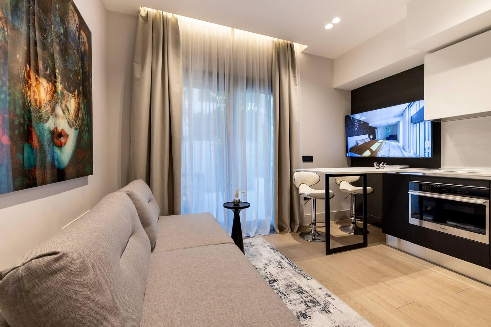 Relax in comfort with designer décor and sofa.